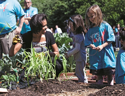 First Lady Michelle Obama participates in a Garden Harvest Event with children and members of the American Indian community in the White House Kitchen Garden on the South Lawn of the White House, June 3, 2011. (Official White House Photo by Samantha Appleton)