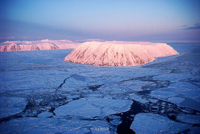 Aerial of Little Diomede Island, with Big Diomede in background.  Located in the Bering Strait, 25 miles northwest of Cape Prince of Wales and 80 miles northwest of Teller. The international boundary between the U.S. and Russia lies between Big and Little Diomede Islands.