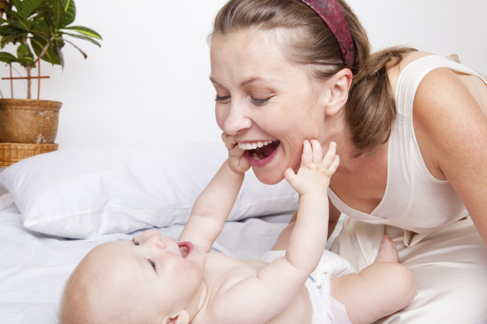 Mom playing with her cute baby